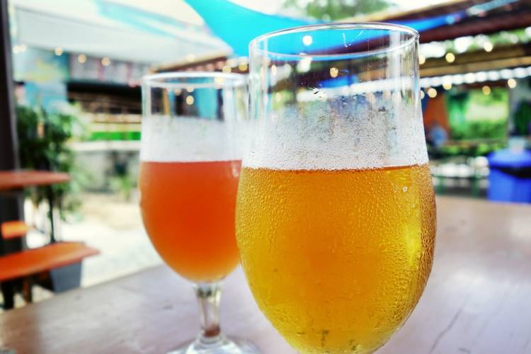 Craft beer pints on a patio beer garden in Asheville NC