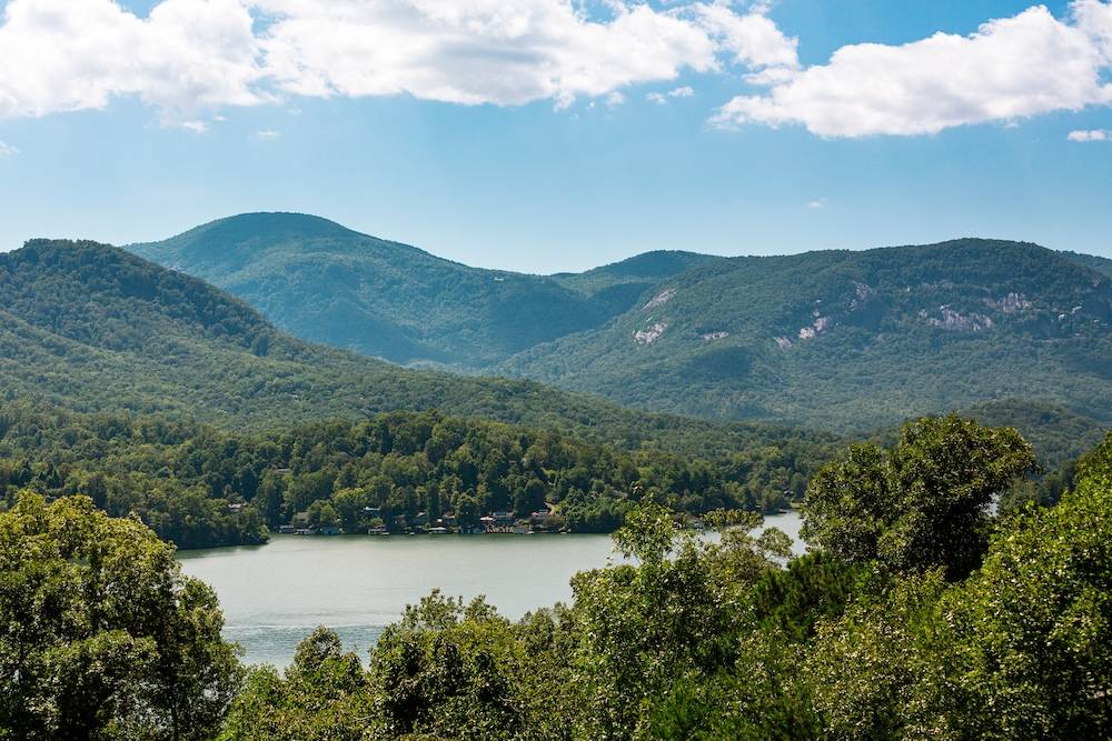 Lake Lure, NC Aerial Above View Of Lake and Chimney Rock Mountain.